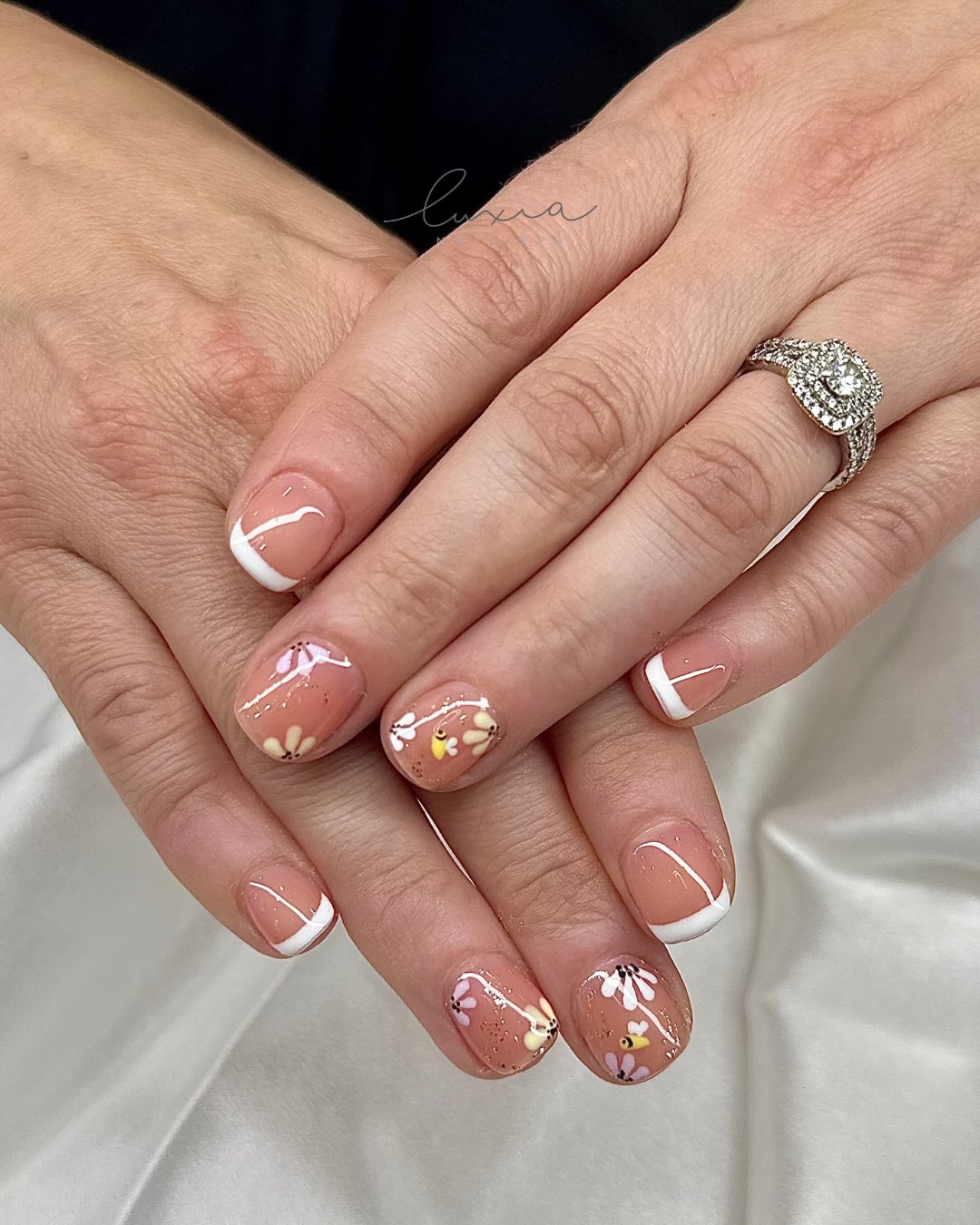 Classic French tips with delicate hand-painted florals